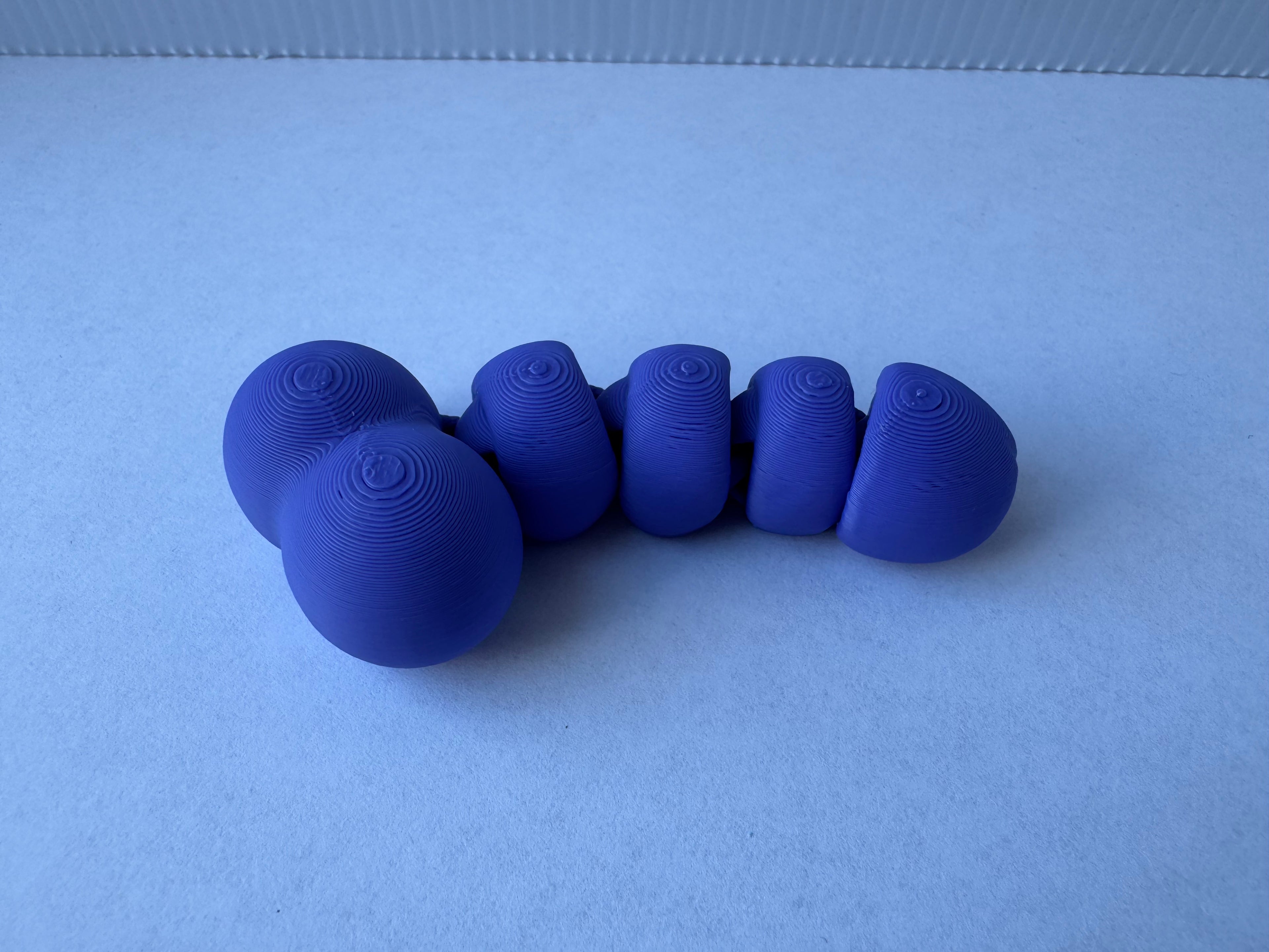 Articulated piemel fidget toy