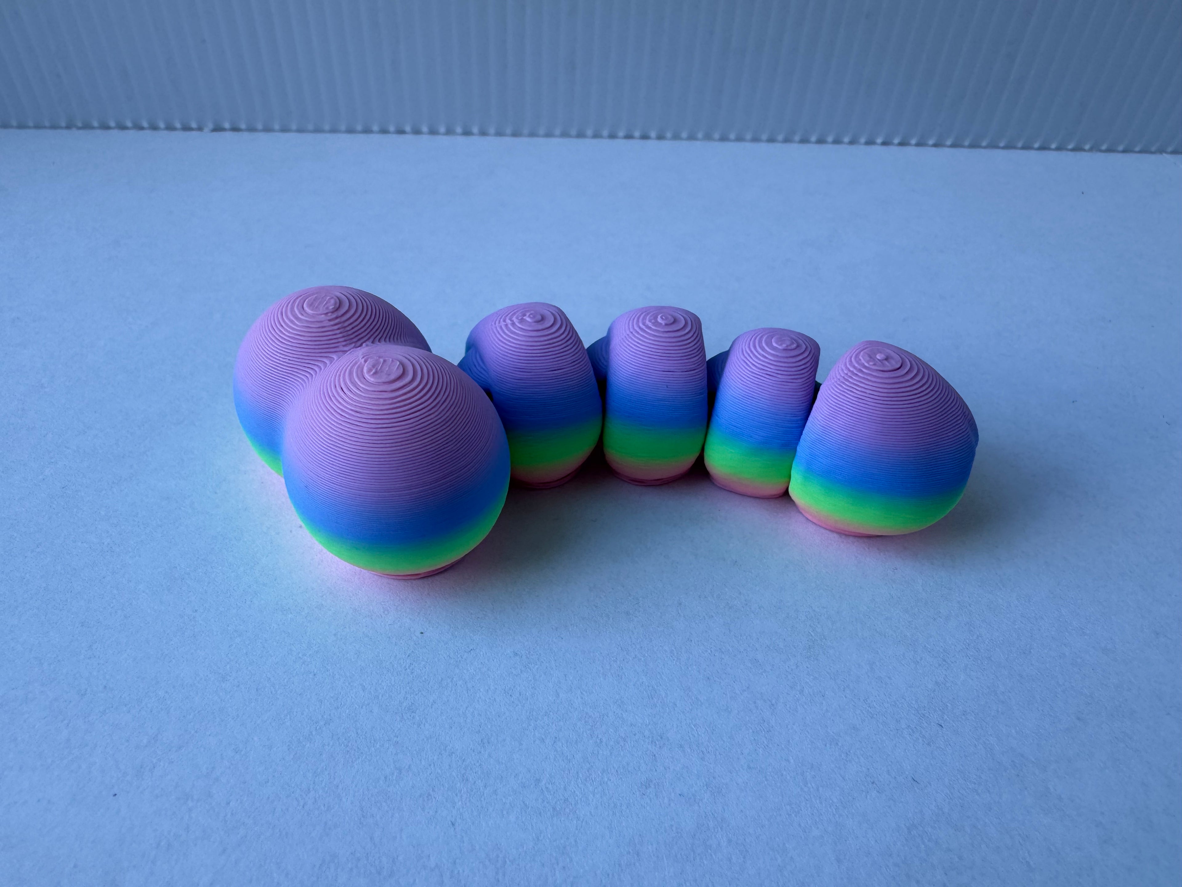 Articulated piemel fidget toy